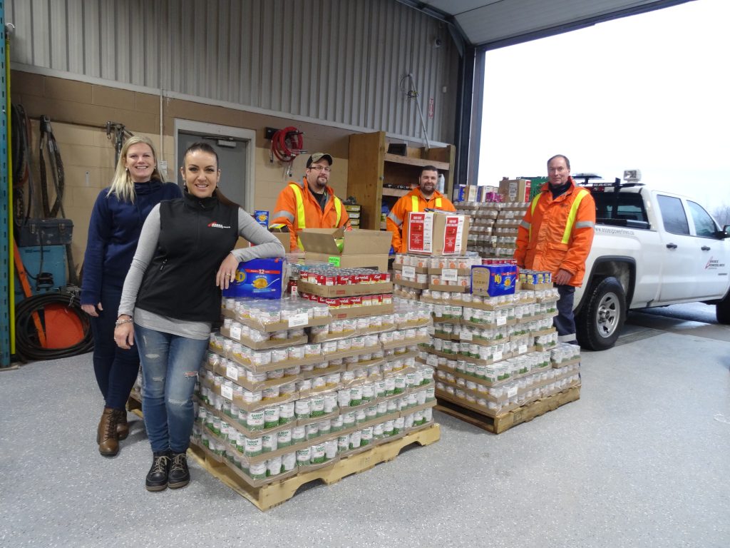 Employees with canned goods