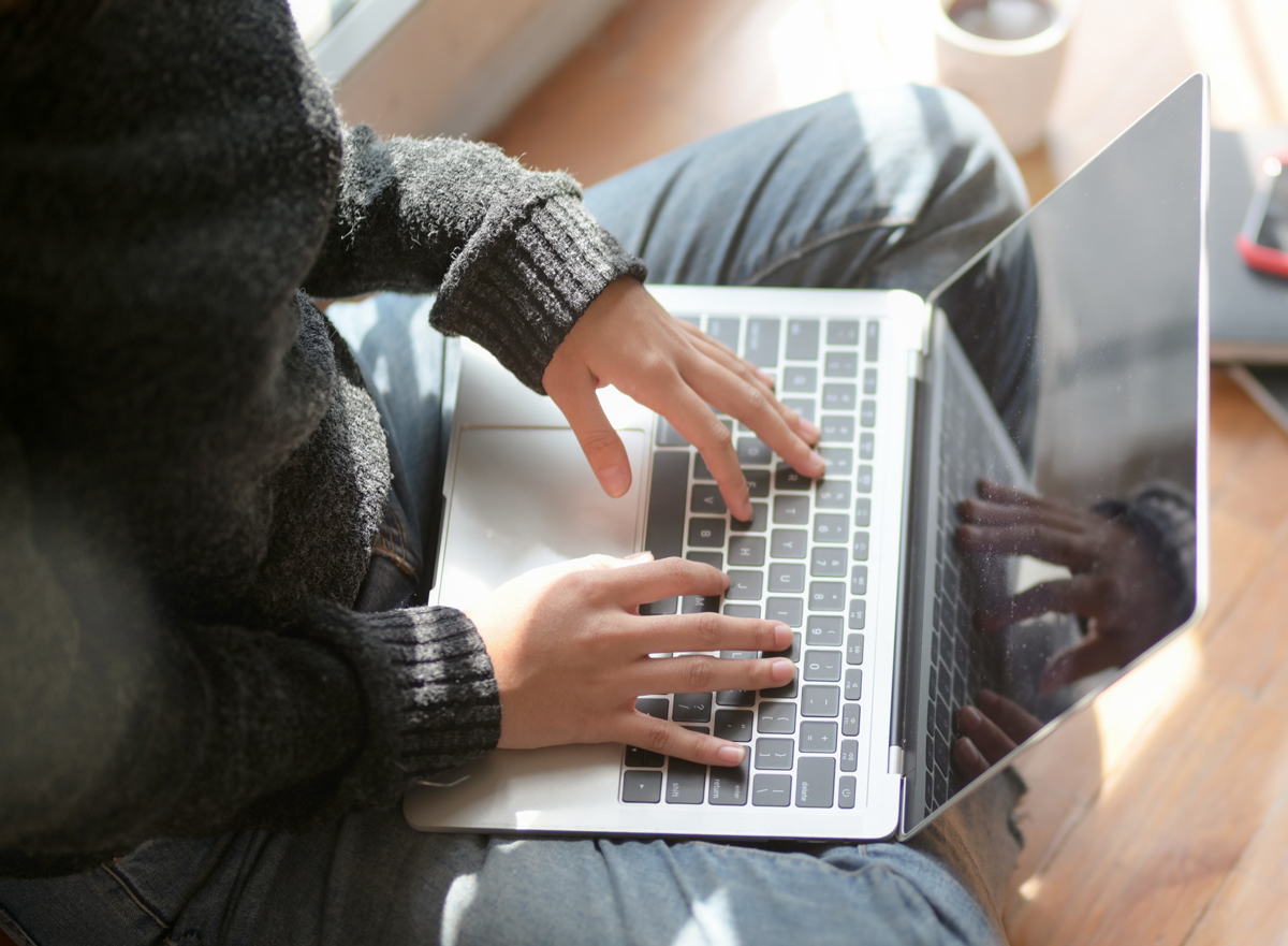 women sitting at computer