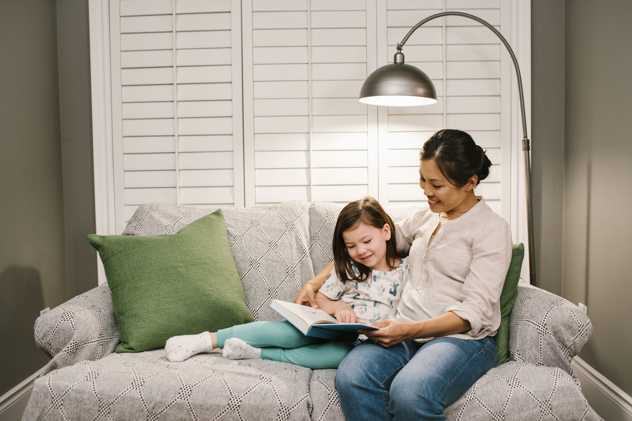 Women and daughter on couch